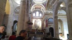 Interior of Gagliari Cathedral with ornate architectural details and religious artworks