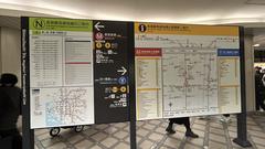 Shinsaibashi Station underground metro entrance with vibrant green signs