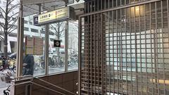 Osaka Metro Shinsaibashi Station entrance with signage and street view
