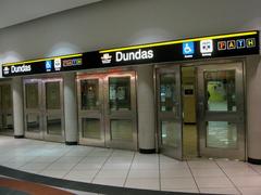 Toronto TTC Dundas Station subway platform with trains and passengers