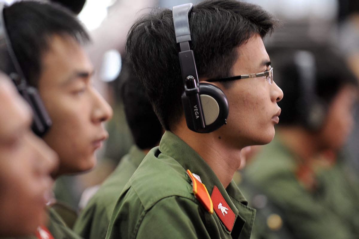 Vietnamese military members listening to U.S. Defense Secretary Robert M. Gates speaking at Vietnam National University in Hanoi