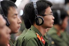 Vietnamese military members listening to U.S. Defense Secretary Robert M. Gates speaking at Vietnam National University in Hanoi