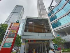 Urban intersection with Shenzhen Broadcasting Center and surrounding buildings in Futian District, Shenzhen in June 2025