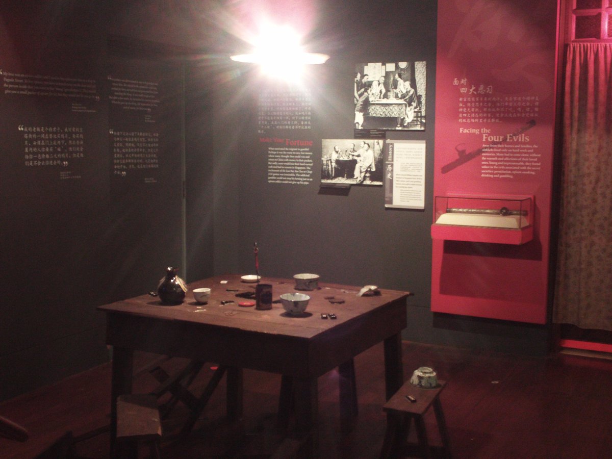 Replica of traditional drinking and gambling table inside Chinatown Heritage Centre