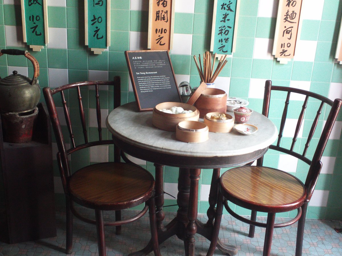 Replica of a traditional restaurant table inside Chinatown Heritage Centre