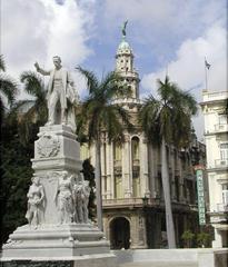 Statue of José Martí in Central Park Havana Cuba with Hotel Inglaterra in background