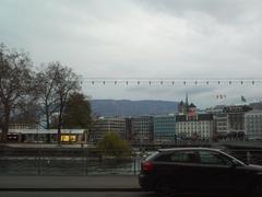 View from Quai des Bergues towards Ile Rousseau and Old Geneva with mountain Salève in the background