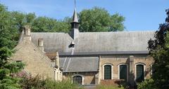 South side view of Saint Elizabeth Church in the Beguinage of Bruges with yellow brick Beguine house number 7