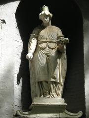 Facade of Begijnhofkerk Sint Elisabeth with statue of Saint Elisabeth in Brugge