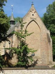 Interior view of Begijnhofkerk Sint Elisabeth choir enclosure in Brugge with gothic architectural details and seating