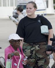 U.S. Air Force Senior Airman Kayla Smith awaiting evacuee transportation at Kelly Air Force Base during Hurricane Gustav evacuation