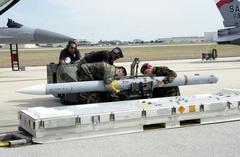 US Air Force personnel securing an AIM-120 Advanced Medium Range missile at Kelly Air Force Base Texas