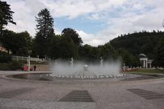 Scenic view of Mariánské Lázně spa town with historic buildings and lush greenery