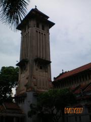 Front view of Cửa Bắc Church with yellow facade and arched windows