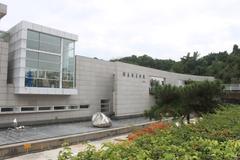 He Xiangning Art Museum building in Futian District, Shenzhen, China with modern architecture and blue sky