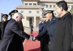 Secretary of Defense Robert M. Gates greeted by Chinese Minister of Defense Liang Guanglie's staff at Bayi building in Beijing, 2011