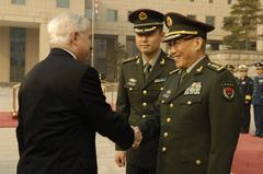 U.S. Defense Secretary Robert Gates greeting Chinese Defense Minister Gen. Cao Gangchuan in Beijing