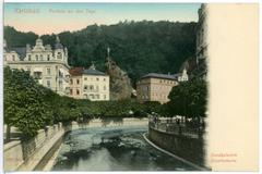 Historical view of Karlsbad with people on the Tepl bridge in 1901