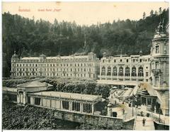 Historic Hotel Pupp building in Karlsbad with vintage cars and horse-drawn carriage