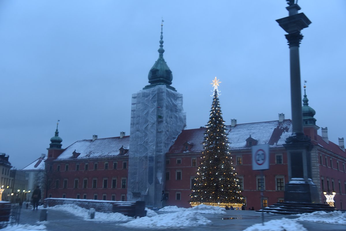 Winter scene of Warsaw cityscape with historical buildings and a partially frozen river in January 2018