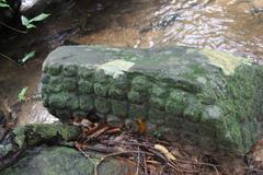 Ancient rock carvings in the Siem Reap River at Kbal Spean