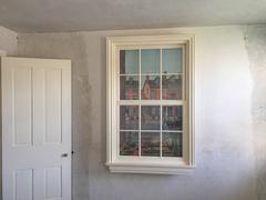 Painting of Edgar Allan Poe National Historic Site historic cityscape framed in a window in Pennsylvania