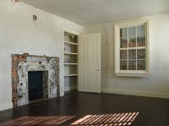 Interior of Edgar Allan Poe National Historic Site showing original bare and unrestored rooms