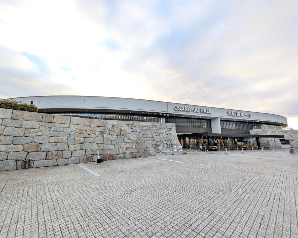 Osaka-jo Hall modern arena in Osaka, Japan with colorful sky at sunset