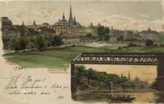 Panorama of Plzeň city with a small boat on river in the bottom right corner
