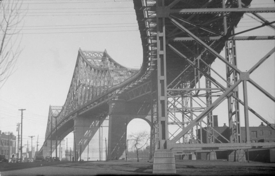 View of the Jacques Cartier Bridge structure in Montreal over the water