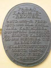 Plaque on facade of Warsaw University's Kazimierz Palace summarizing building's history