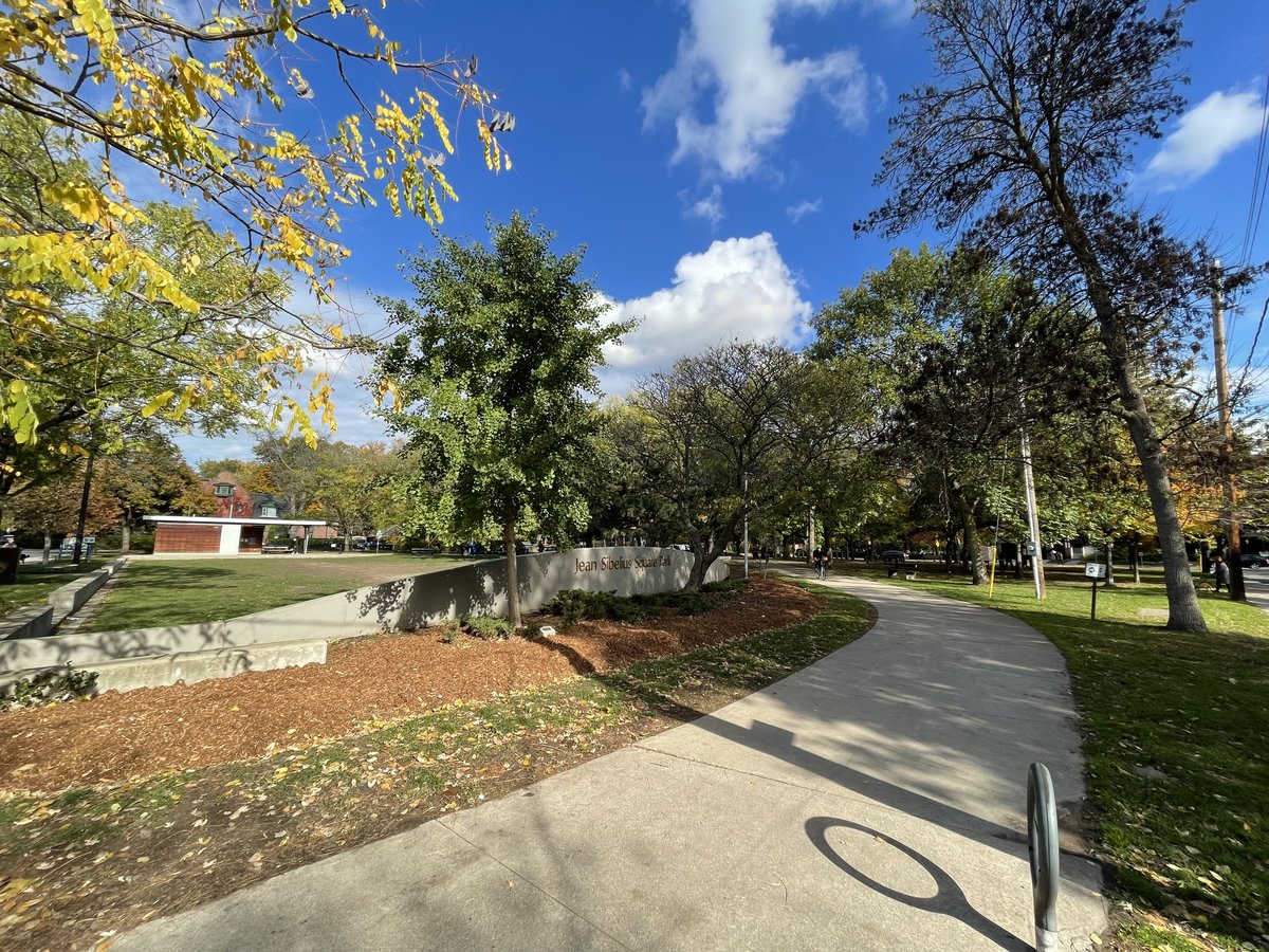 Jean Sibelius Square in Toronto with trees and benches in autumn