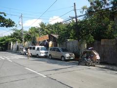 Pinagtipunan Circle at MacArthur Highway in Potrero, Malabon City with traffic and urban surroundings