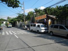 View of Pinagtipunan Circle at the intersection of MacArthur Highway and Governor Pascual Avenue in Potrero, Malabon City showing traffic and nearby landmarks