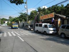 Pinagtipunan Circle at MacArthur Highway in Potrero, Malabon City with nearby landmarks including Potrero Elementary School, Malabon City Barangay Hall, and Malabon Zoo