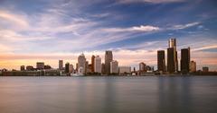Detroit skyline at sunset viewed from Windsor, Canada with river and cityscape