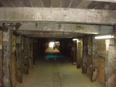 View of Cockatoo Island tunnels in New South Wales with rugged rock walls and a dirt path
