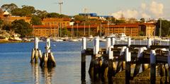 Scenic view of Balmain suburb from Cockatoo Island across water under blue sky