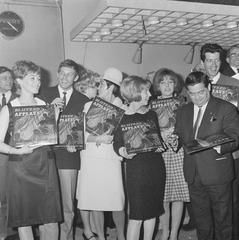 Black and white photo of Dutch singers and artists at the launch of 