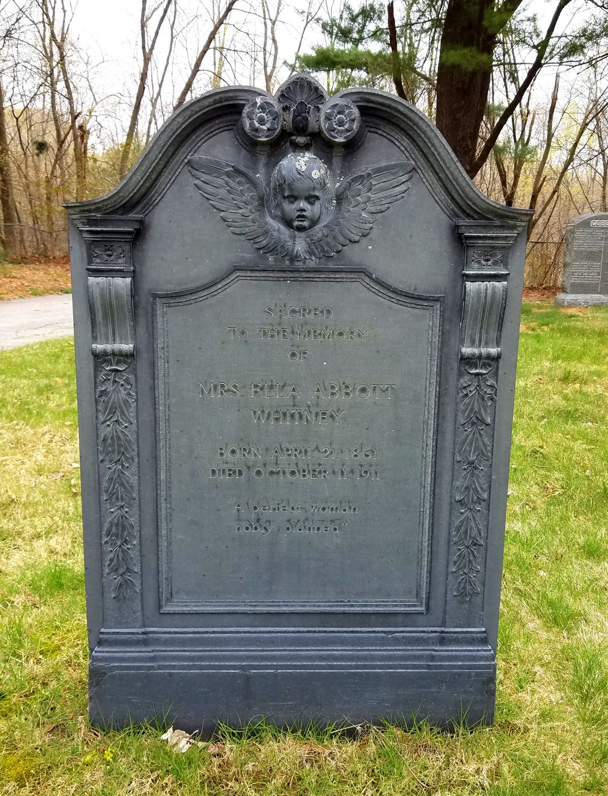 Tombstone of Mrs. Ella Abbott Whitney at Munroe Cemetery in Lexington, Massachusetts