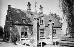 Sashuis Slusshus building built in 1519 above the lock at the canalized Minnewater Lake in Bruges, renovated in late 1800s