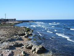 Coastal view of Cojimar in Cuba with blue sea and sky