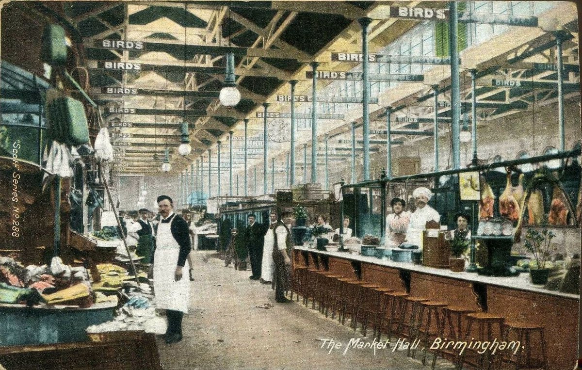 Interior of Birmingham Market Hall with bustling market stalls and shoppers