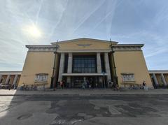 Székesfehérvár railway station building exterior with passengers and taxis