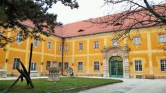 Interior view of Kiscelli Museum with arched ceilings and historical exhibits