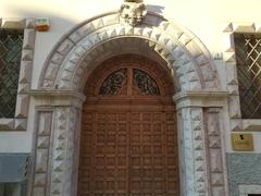 Close-up view of the south door of Palazzo Calepini in Trento, Italy from Via Calepina