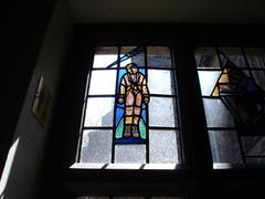 Decorative stained glass window outside Strachan Hall in Trinity College Toronto on a spring Sunday morning