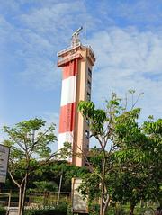 Light House in Chennai with clear blue sky and ocean in the background