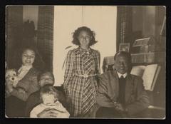 Family photo of Tole Madna, housemaid, two daughters, and Jewish child Alfred Munzer during World War II