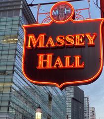Massey Hall sign illuminated at night with glowing lights